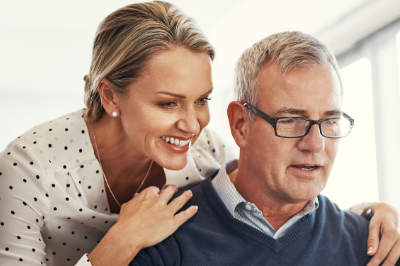 Couple Reviewing Laptop